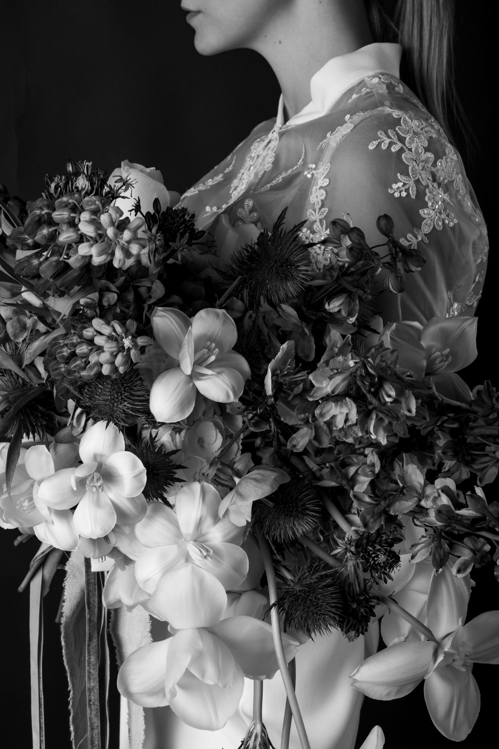 Bride holding a bunch of luxurious flowers