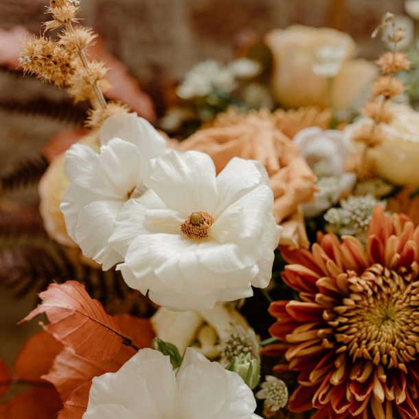Vibrant autumn bouquet in orange, brown and white
