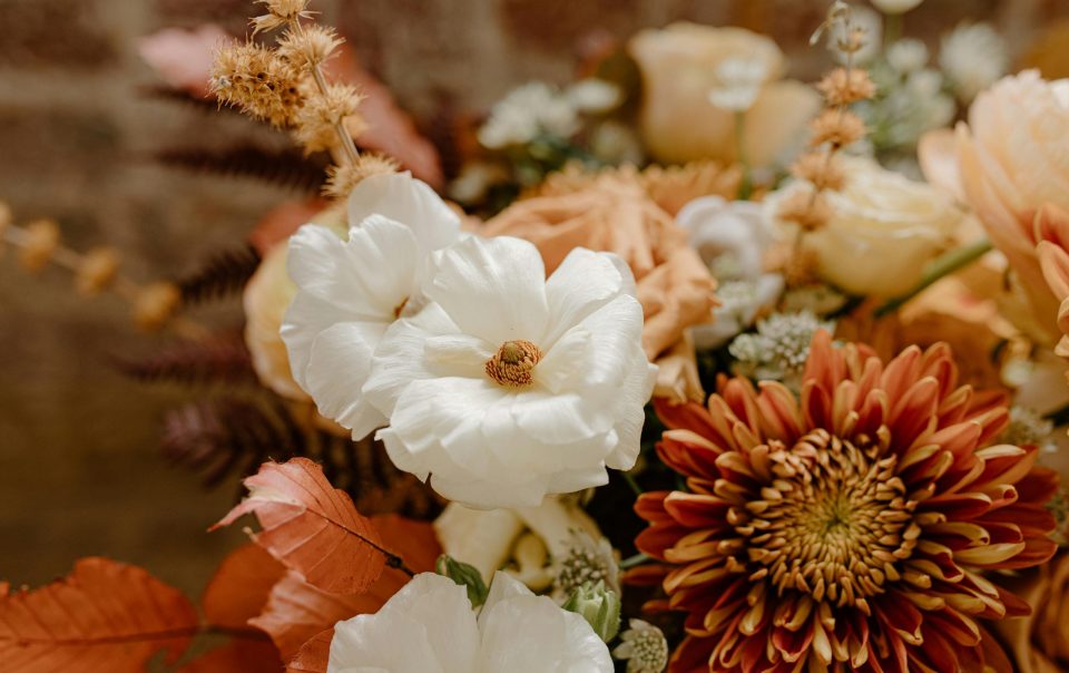Vibrant autumn bouquet in orange, brown and white