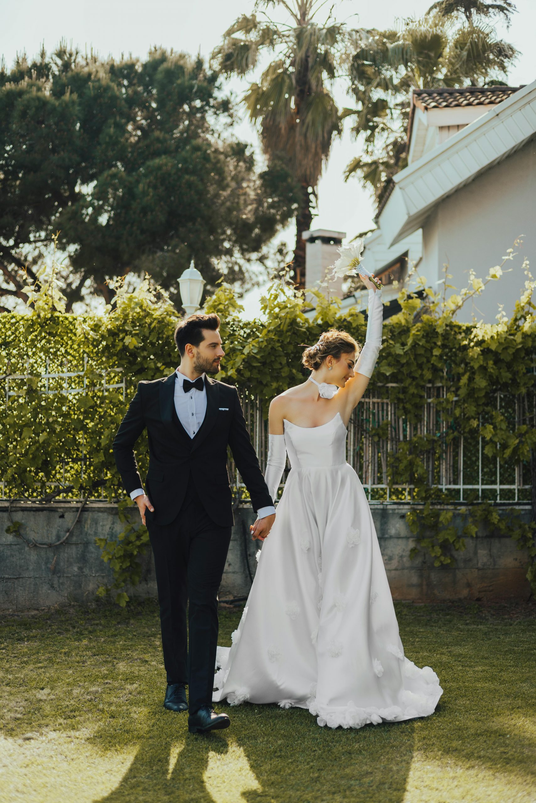 Wedding couple having fun photoshoot