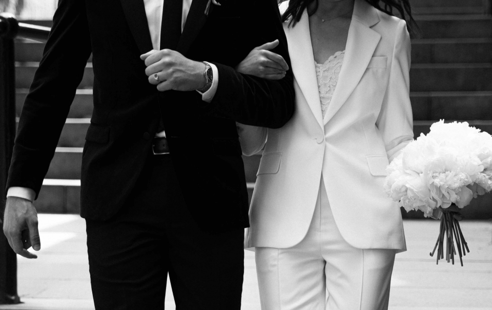 Bride and groom walking down the stairs