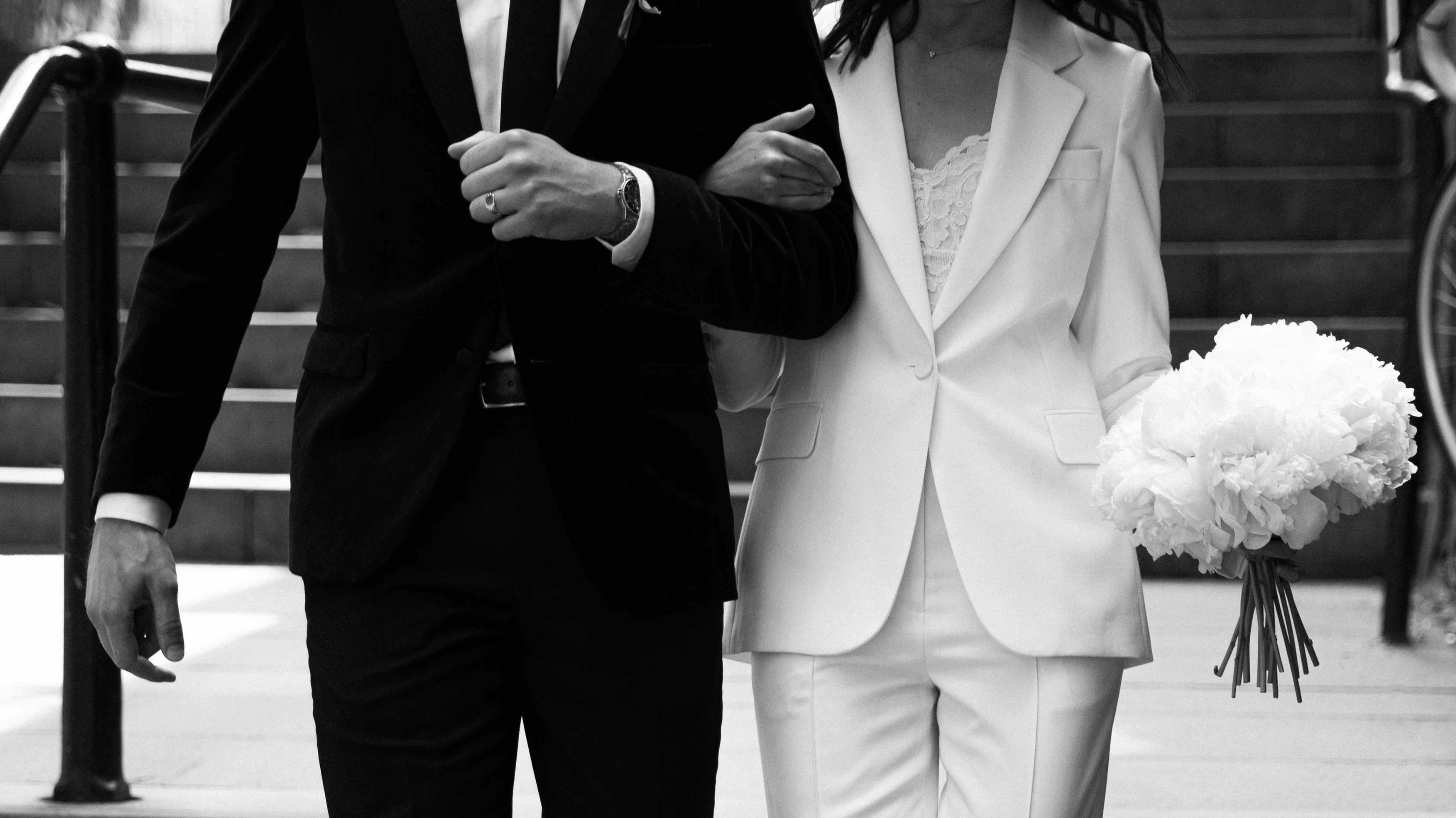 Bride and groom walking down the stairs