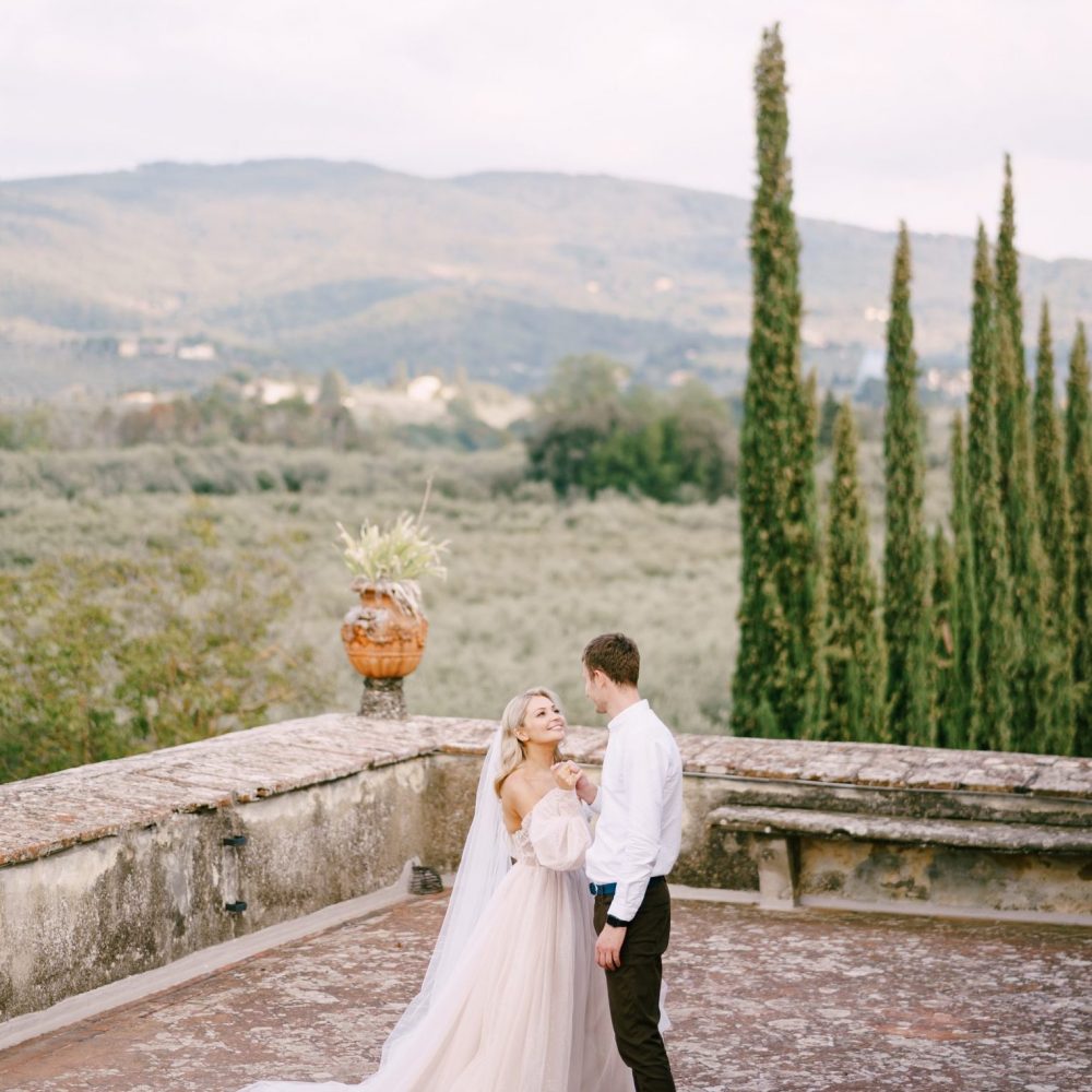 Wedding at an old winery villa in Tuscany, Italy The bride and groom dancing on the roof of the old winery villa in Tuscany